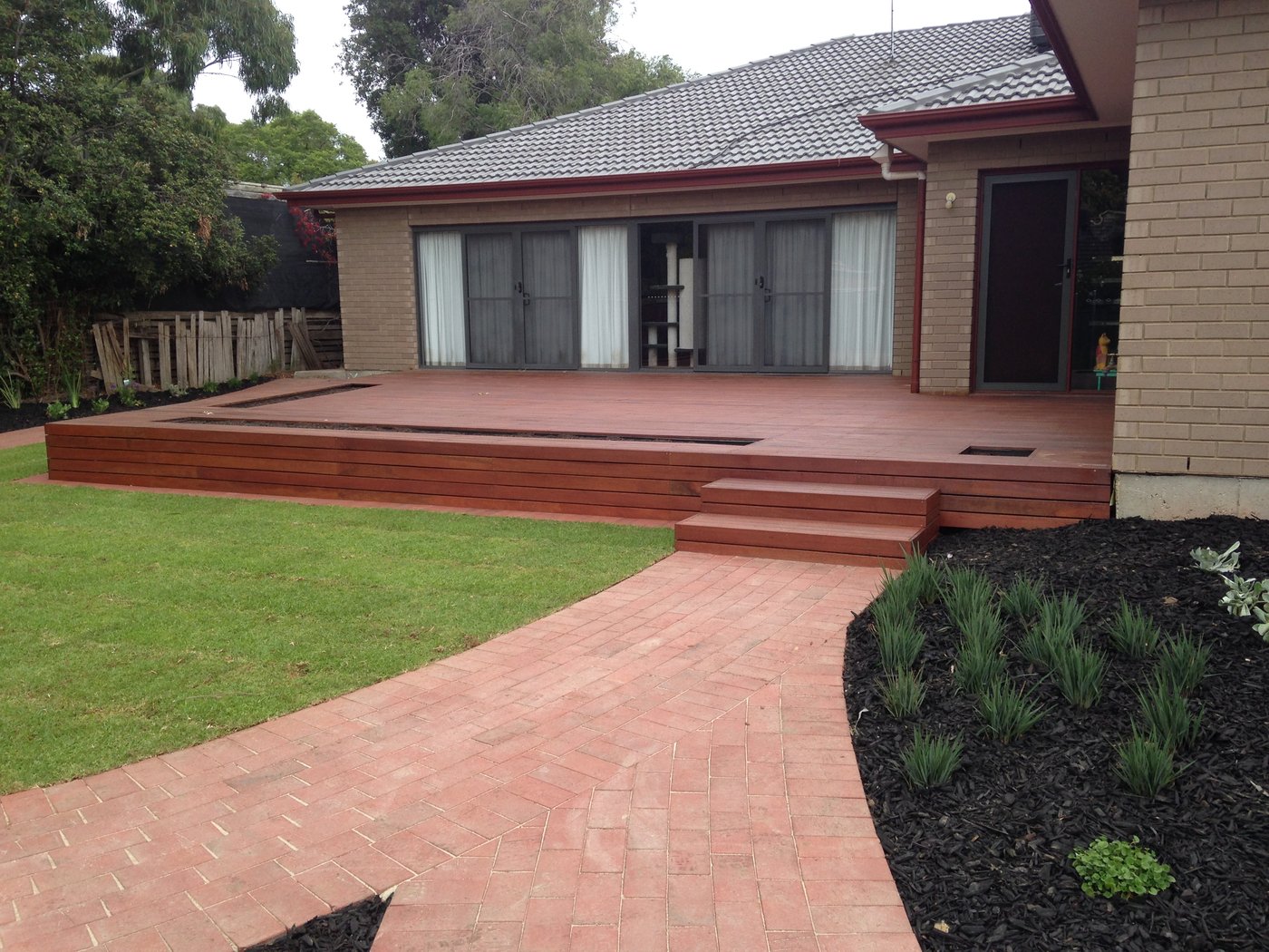 Finished hardwood deck, steps, brick paved path and new lawn at a house in Oaklands Park
